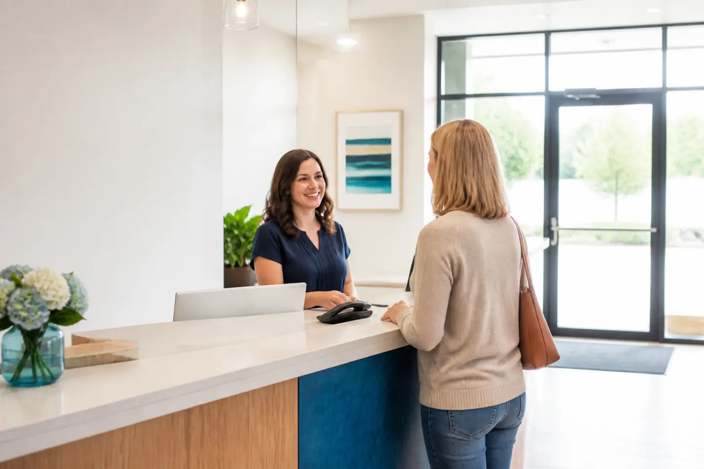 Patient being welcomed at the Port Dover Family Dentistry reception desk