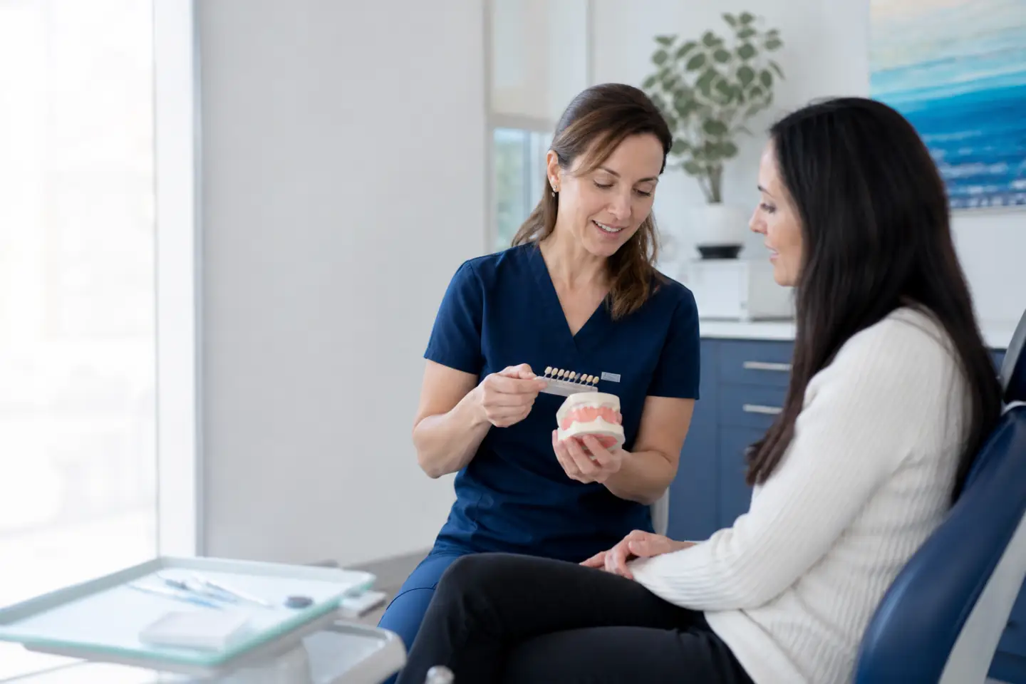 Dentist discussing dental bonding with an adult patient